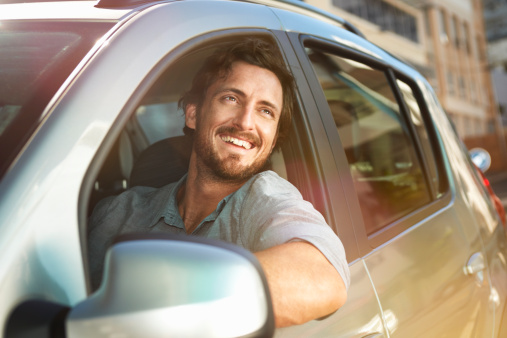 happy driver in car